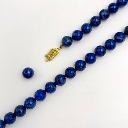 NECKLACE made of 54 round lapis lazuli beads...