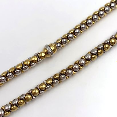 null Yellow and white gold (750‰) looped necklace. Length : 44,5 cm. Weight: 64 ...