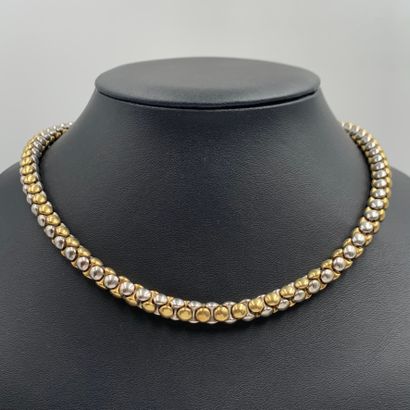 Yellow and white gold (750‰) looped necklace....