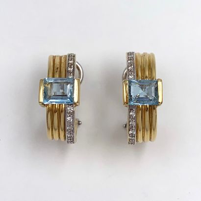 Pair of yellow and white gold (750‰) cambered...