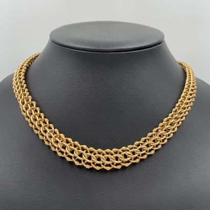 null A yellow gold (750‰) drop necklace, with interlaced and partially gadrooned...