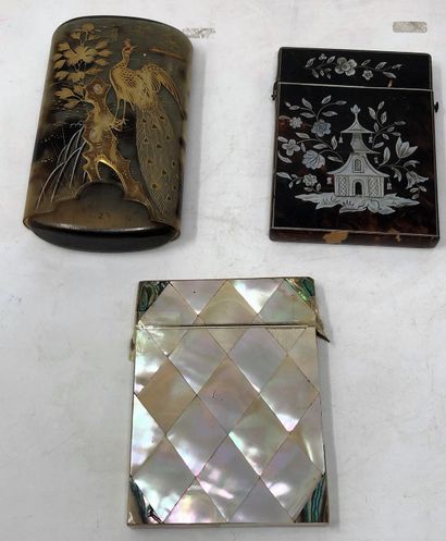 null Set of three cases including:

- a tortoiseshell case with pagoda and fluttering...