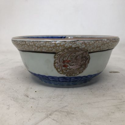 null Small porcelain cup with blue and gold decoration of dragons, phoenix and stylized...