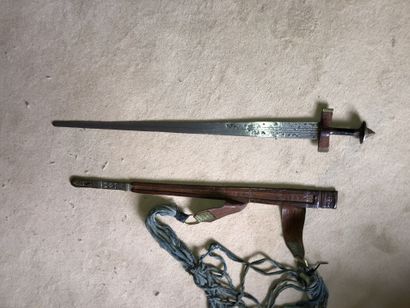 null Tuareg sword

Iron and brass frame.

Handle and scabbard covered with embossed...
