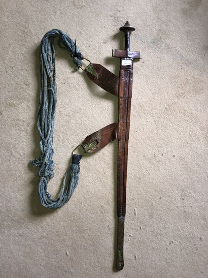 null Tuareg sword

Iron and brass frame.

Handle and scabbard covered with embossed...