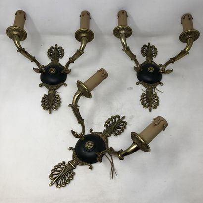 null Three chased bronze and lacquered sconces with two arms

Restoration style,...
