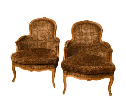 null Pair of bergères in natural wood, moulded and carved with flowers

Louis XV...