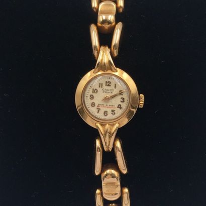 null BRACELET WATCH round lady in yellow gold (750 thousandths). Stylized attachments...