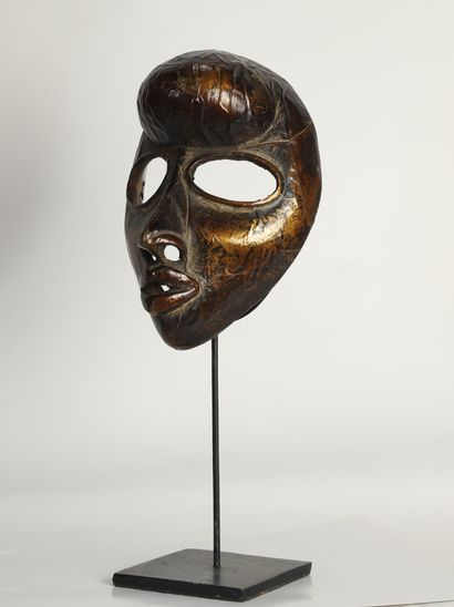 null Mask in patinated wood covered with copper, in the style of the Dan product...