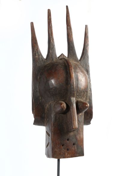 Mask in patinated wood with a zoomorphic...