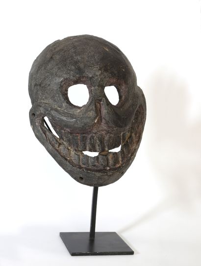 null Citipati" mask with a smiling skull. Wood with a brown patina slightly thicker...