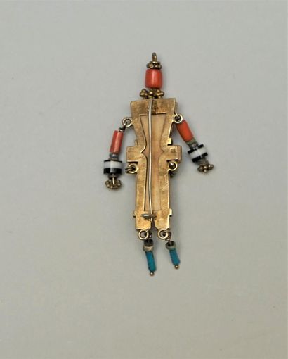 null Ethnic" brooch presenting a stylized character in bone decorated with small...