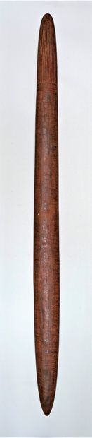 null COMBAT BATON - in hardwood, with incised patterns of vertical parallel lines...