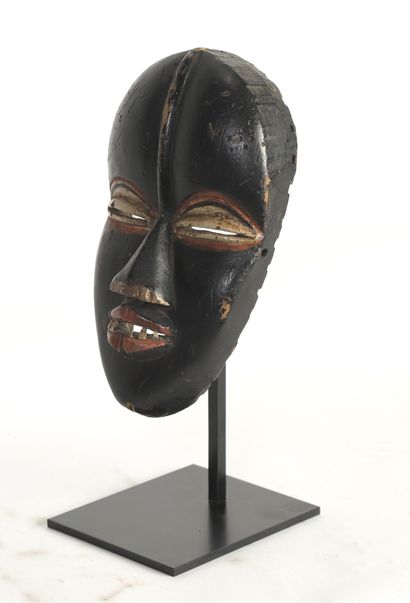 null Dance mask with an intense expression accentuated by half-closed eyes and an...