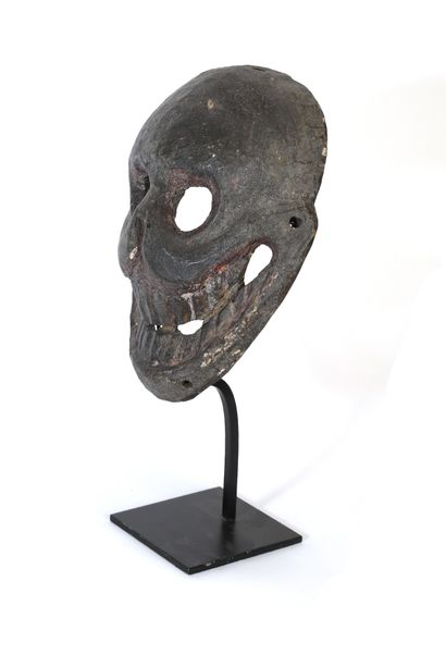 null Citipati" mask with a smiling skull. Wood with a brown patina slightly thicker...