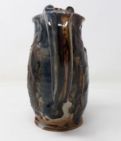  PORTAL Lionel 
Stoneware pitcher with blue and brown glaze, signed in hollow 
H.:...