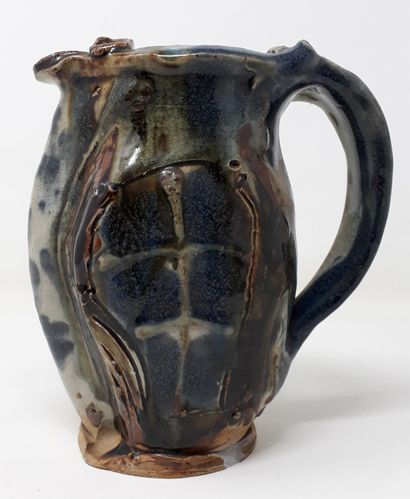  PORTAL Lionel 
Stoneware pitcher with blue and brown glaze, signed in hollow 
H.:...