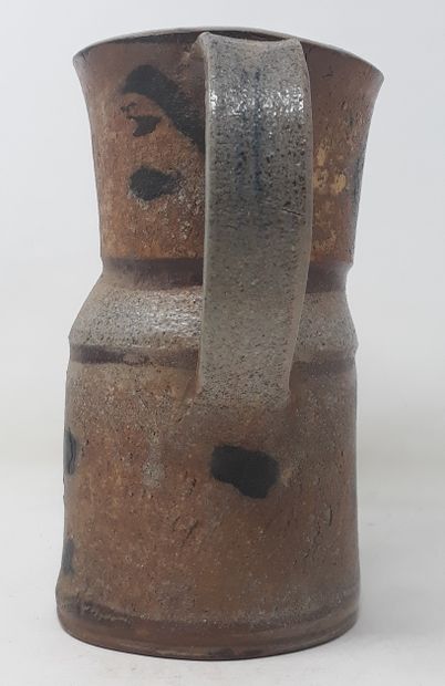 null School Xth century

Straight stoneware pitcher with black decoration, monogrammed...