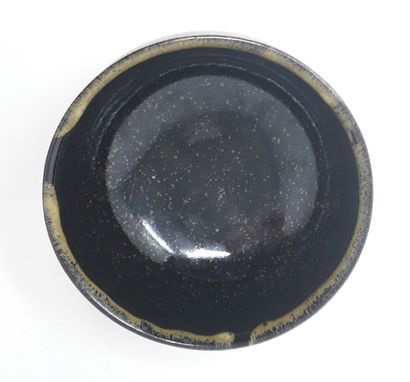  EVE François 
Bowl in stoneware with black and ochre glaze, signed in hollow and...
