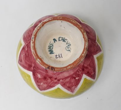null TREE WITH GOATS

Earthenware bowl decorated with green and red zigzags, signed...