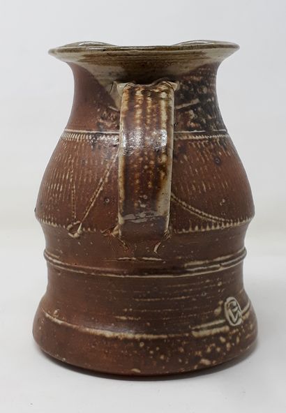 null GALISSAIRES François 
Brown stoneware pitcher with pinched spout and incised...