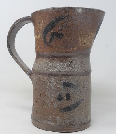  School Xth century 
Straight stoneware pitcher with black decoration, monogrammed...