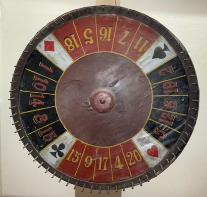 null Roue de loterie en bois et feuille peinte

Début XXe siècle

Diam.: 72 cm