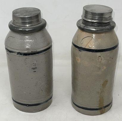 null 
Set of three stoneware tobacco bottles, two of which are pewter-mounted




H.:...