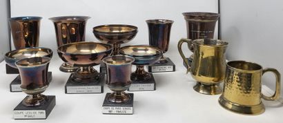null Lot including:

- ten metal competition (golf) cups

- two metal mugs 

- silver...