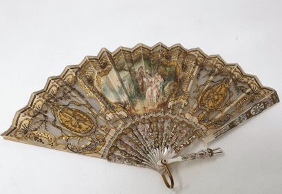 null Silk fan painted with a gallant scene and tulle, decorated with metallic spangles,...