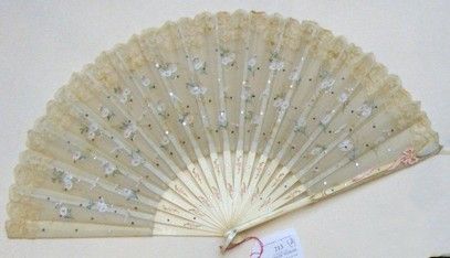 null Fan, the leaf in gauze painted with daisies and sequined, inlaid with a border...