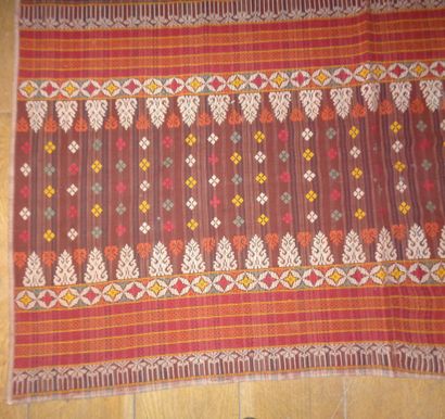 null Sarong ikat, Indonesia, brick red squared canvas, embroidered ends of flowers,...