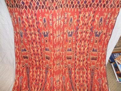 null Sarong Ikat, Tsumba, red background, lizards with human heads.

	2, 37 x 1,...
