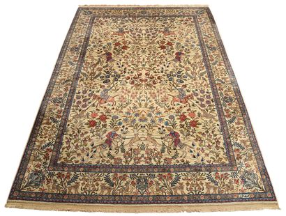 null Carpet with a cream background, decorated with a Persian hunt, border of flowers...