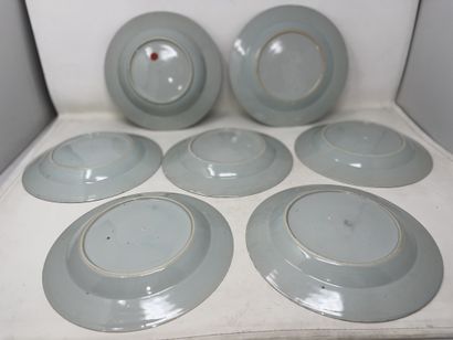 null Suite of six porcelain dinner plates and one soup plate with blue monochrome...