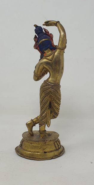 null Gilded bronze and colored statue of Maya Devi dancing, double vajra at the base

Nepal,...
