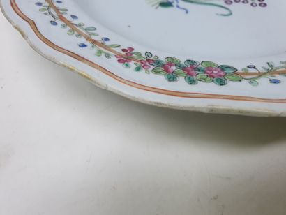 null Porcelain plate decorated with a bouquet of flowers and a golden ribbon on the...