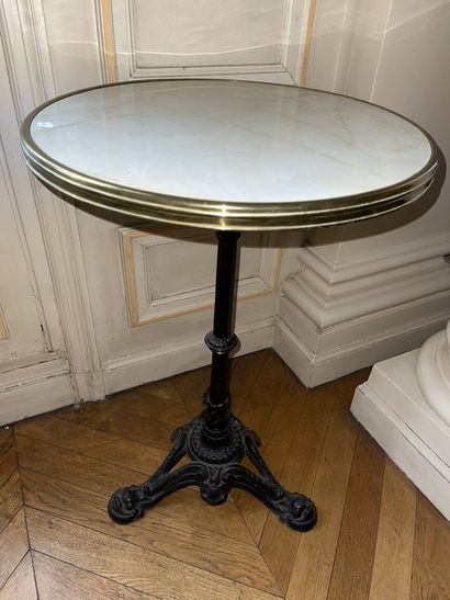 null Bistro pedestal table, wrought iron base and white marble top with gilded brass...