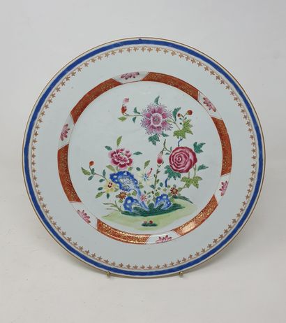 null 
Porcelain dish with "famille rose" decoration of a flowered rock surrounded...