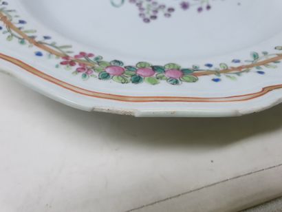 null Porcelain plate decorated with a bouquet of flowers and a golden ribbon on the...