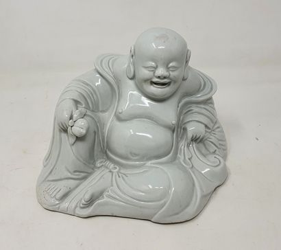 null Chinese white" porcelain statue of Budai smiling, sitting against the bag of...