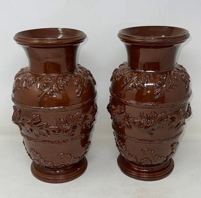 null Pair of brown glazed earthenware vases decorated in relief with friezes of leaves

Regional...