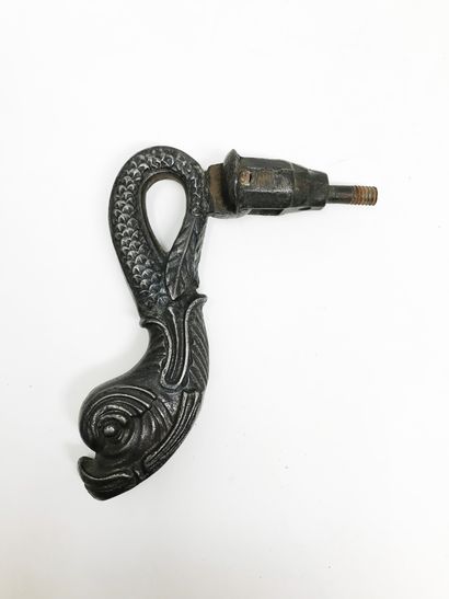 null Iron door knocker with a dolphin on a leafy rose window. 
18, 6 cm. 
Dolphin...
