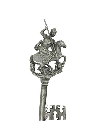 null Cast metal key with decoration of Saint Michael, slaying the dragon. 14, 83...