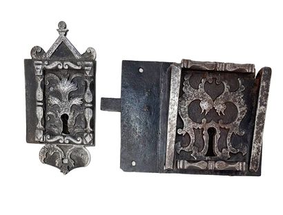 null Two locks of the same workmanship, one (18, 7 x 8, 8 cm) topped by a capital...