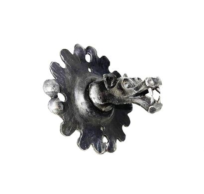 null Pull handle in wrought iron in the shape of a roaring monster's mouth on a poly-lobed...