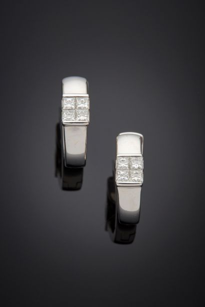 null Pair of white gold (750‰) "creole" EARRINGS each set with four princess-cut...