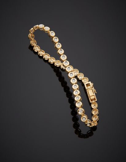 null BRACELET in yellow gold (750‰) set with forty brilliant-cut diamonds in a closed...