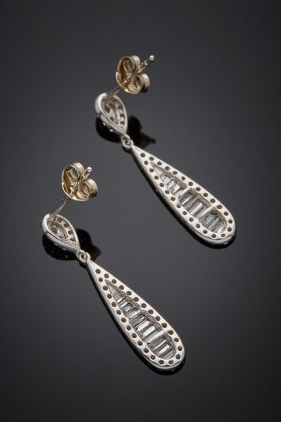 null Pair of white gold (750‰) "drop" EARPENDANTS set with brilliant-cut and baguette...