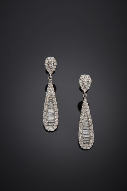 null Pair of white gold (750‰) "drop" EARPENDANTS set with brilliant-cut and baguette...